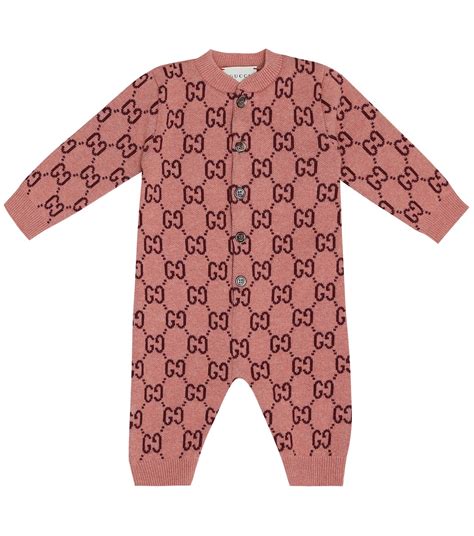 gucci infant onesie.